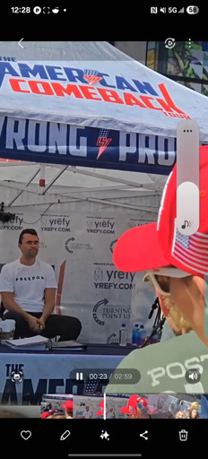 A frame of the then-living Charlie Kirk about to become unalived while spewing anti-trans hate speech.