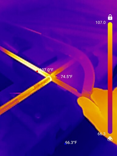 Thermal image of cutting a metal bar with a hacksaw 